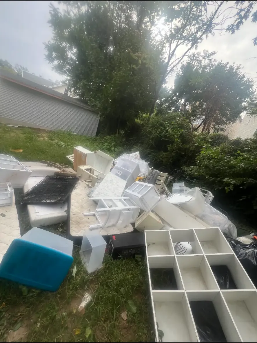 Pile of furniture and household items outdoors